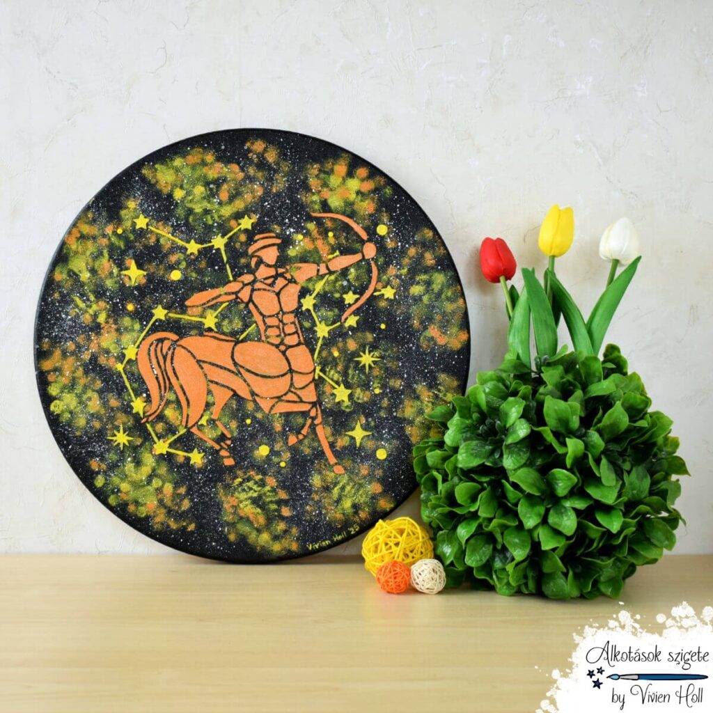 40 cm átmérőjű csillagjegyes festmény, Nyilas mintával, sárgás-narancsos színárnyalatban